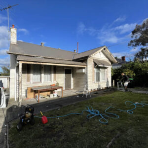 Before photo of weatherboard house exterior